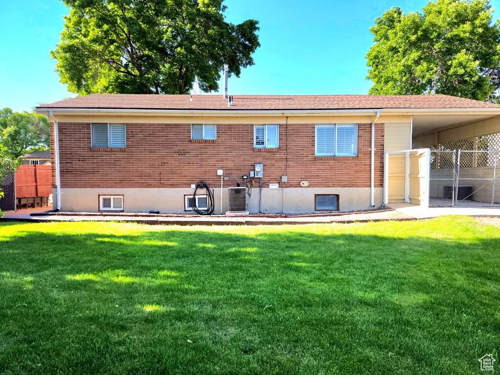 Back of property featuring brick siding
