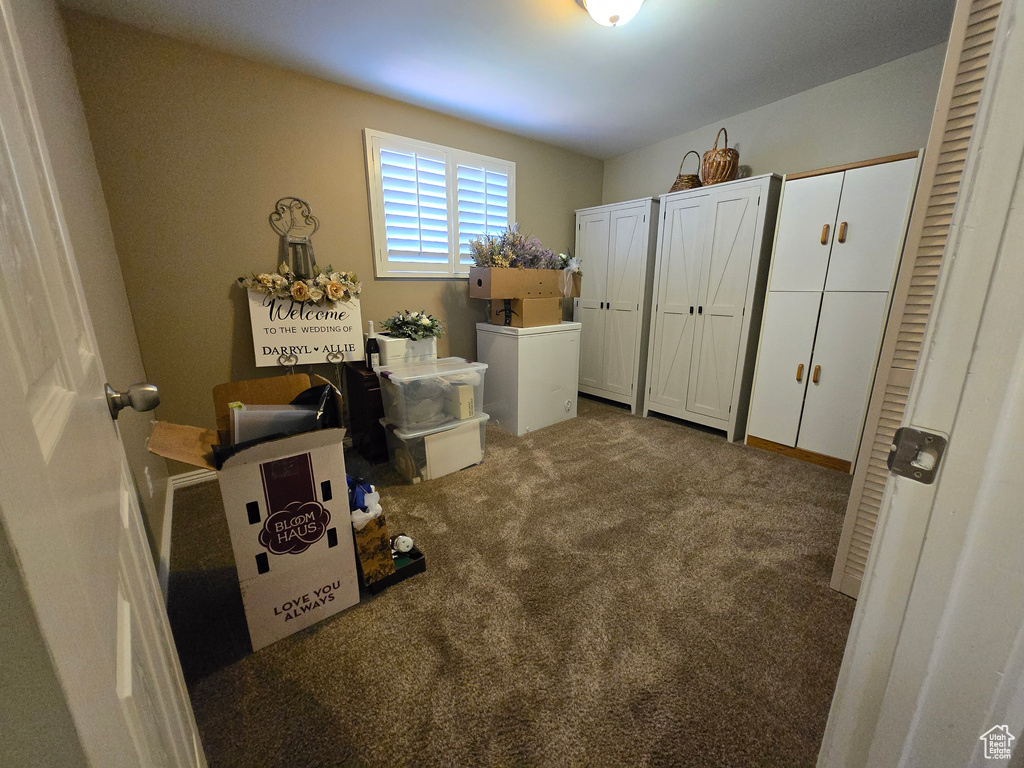 Carpeted bedroom featuring two closets