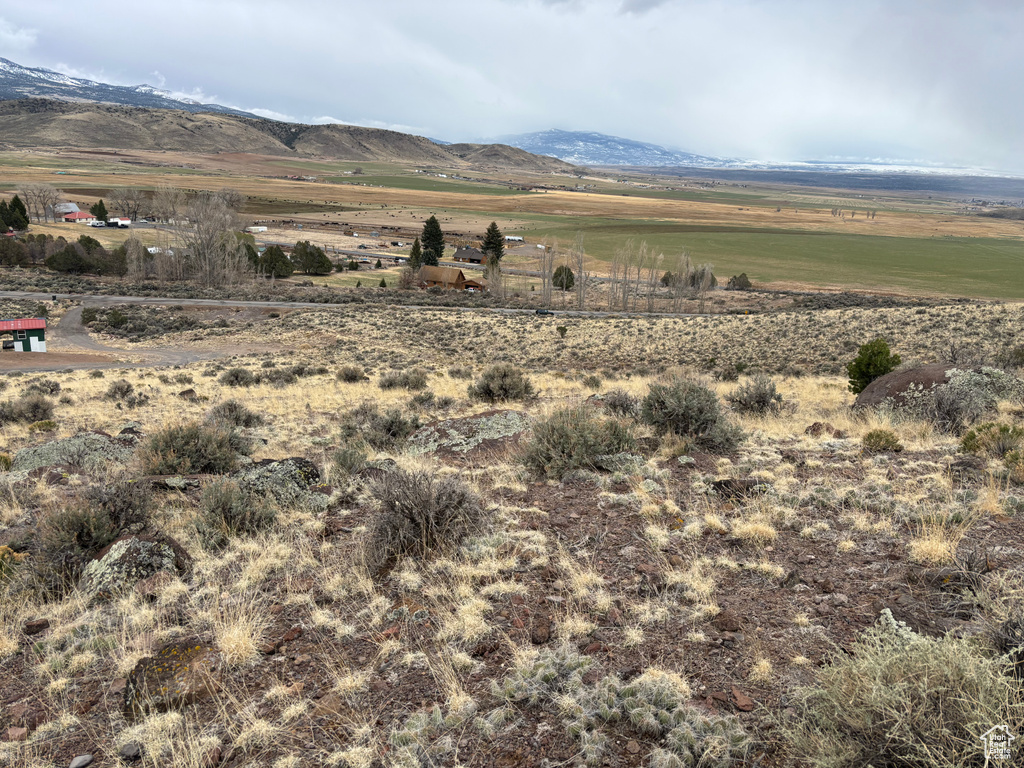 View of mountain background featuring rural landscape