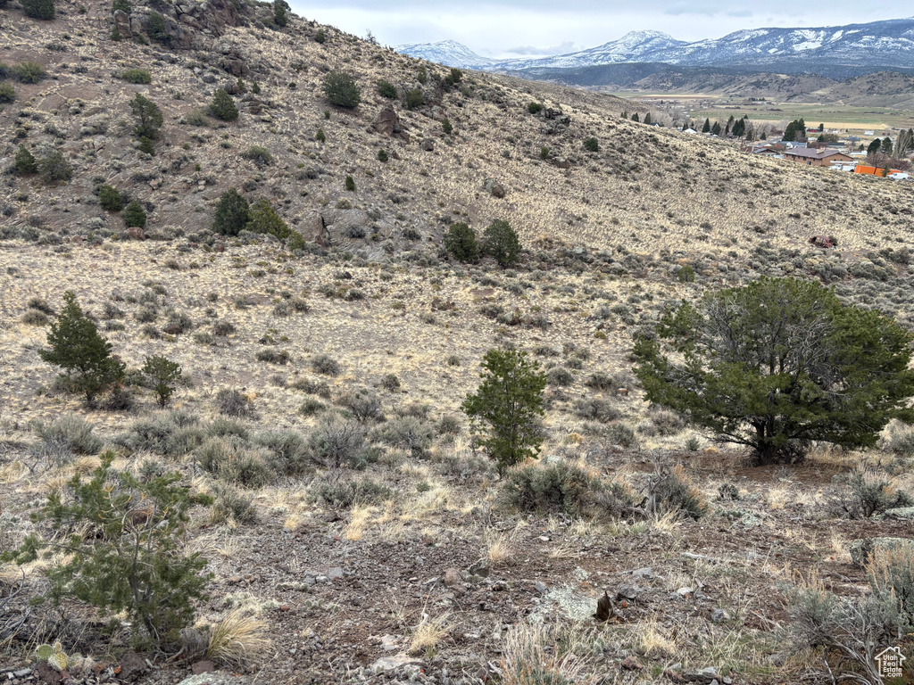 View of mountain background featuring rural landscape