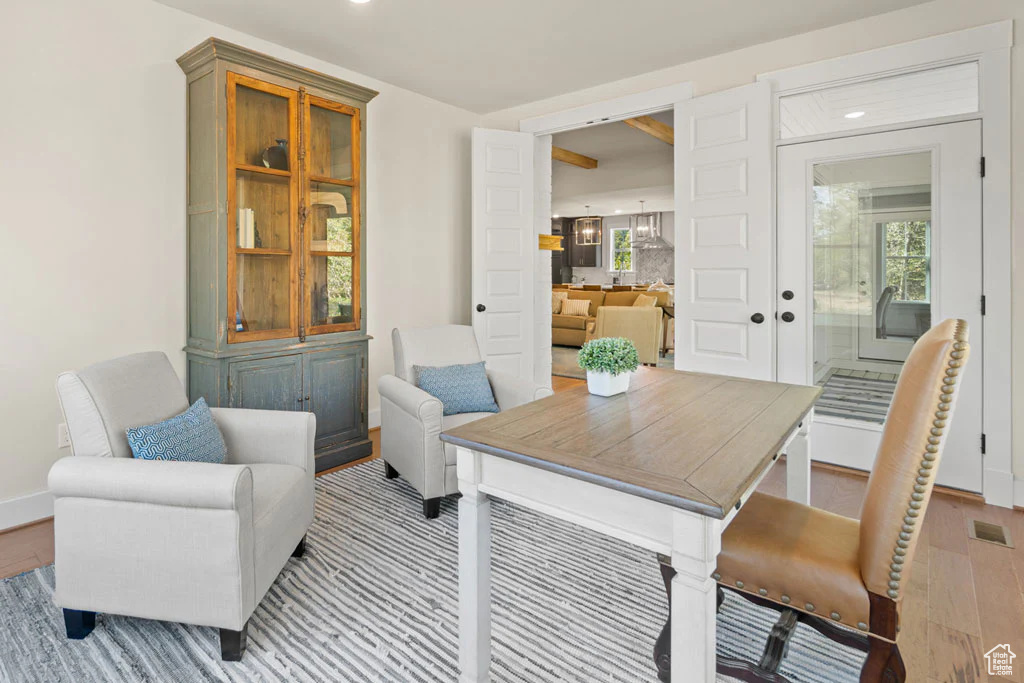 Dining area with light wood-style floors, baseboards, and recessed lighting