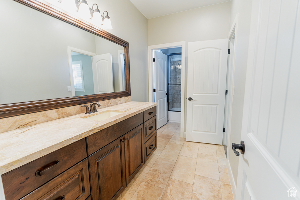 Full bathroom featuring vanity and tub / shower combination
