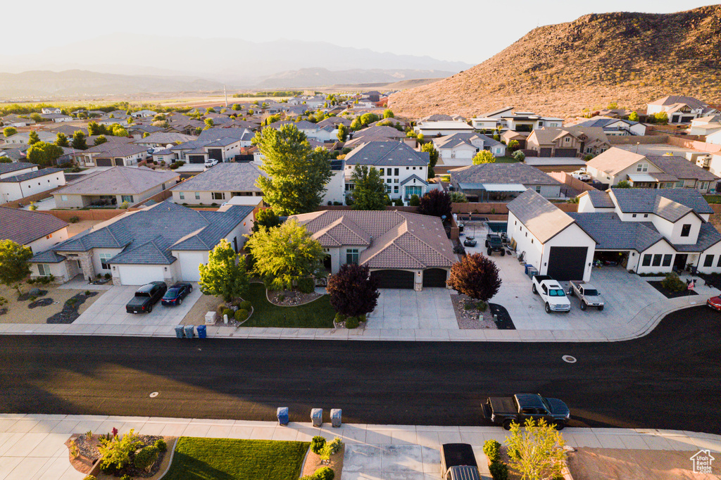 Aerial perspective of suburban area with a mountainous background
