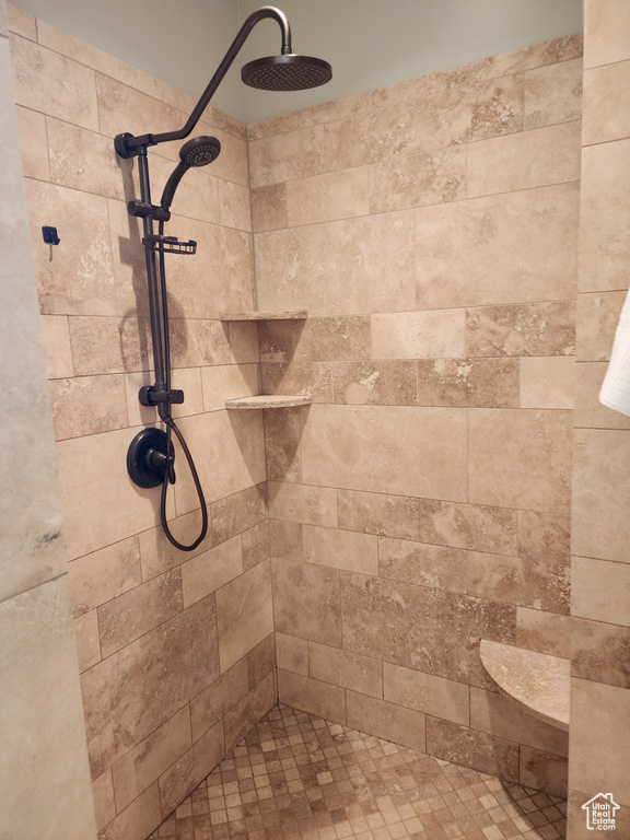 Full bathroom with tiled shower