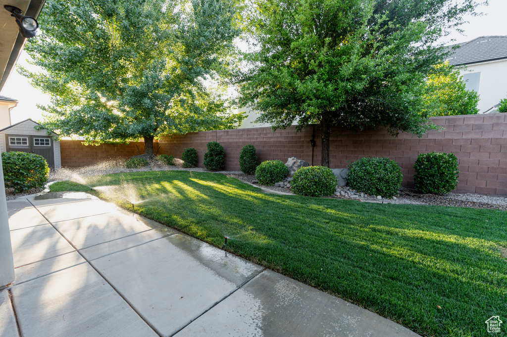View of yard with a patio