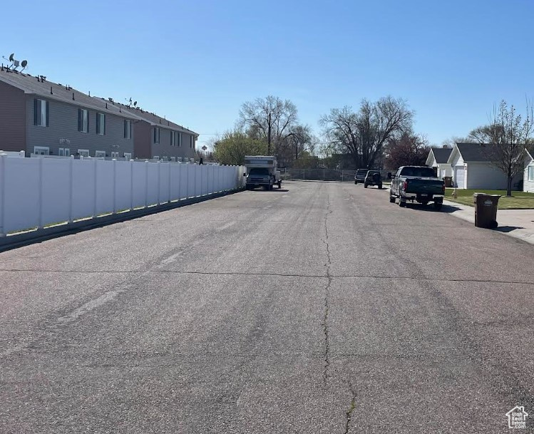 View of asphalt street with a residential view
