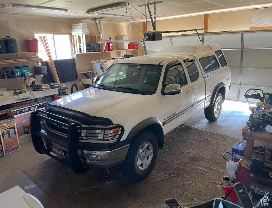 Garage featuring a garage door opener