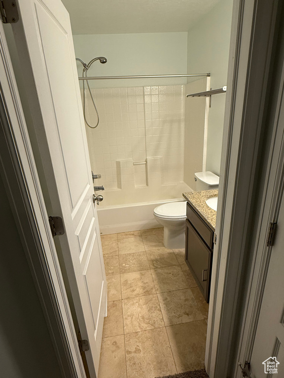 Full bathroom with vanity, washtub / shower combination, and toilet