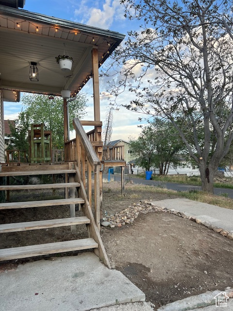 View of yard featuring covered porch
