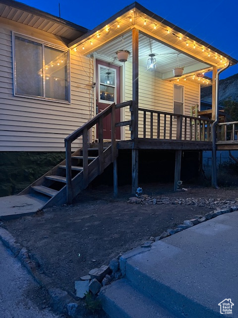 Entrance to property with a wooden deck