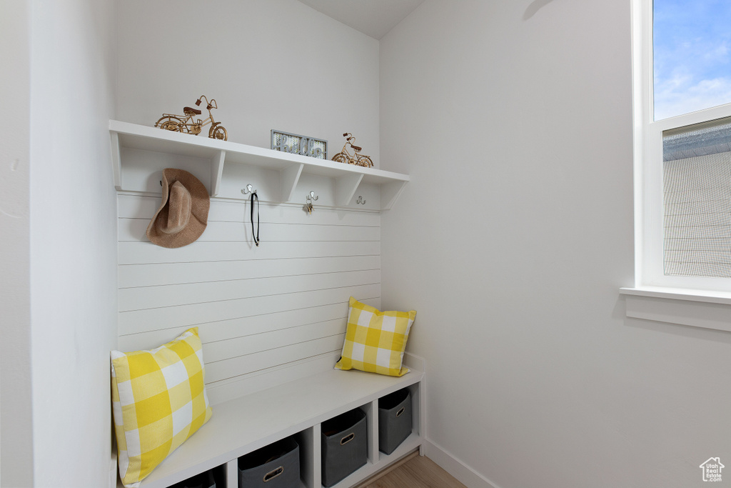 Mudroom featuring baseboards and light wood-style flooring