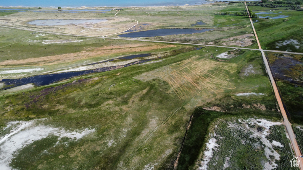 Aerial view of property's location with a nearby body of water
