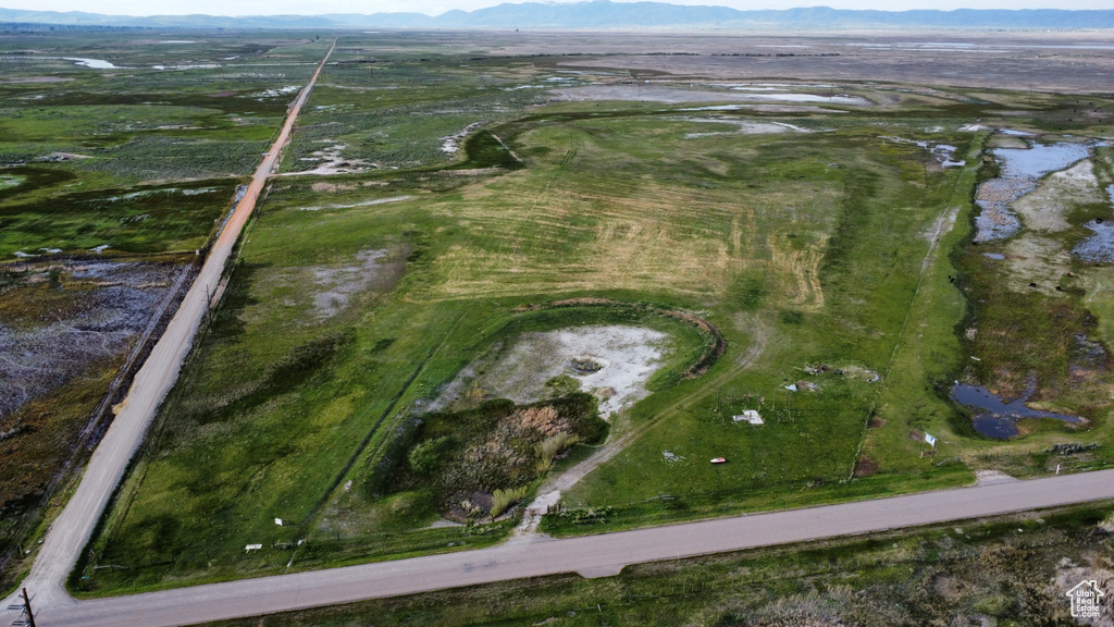 Aerial view of property's location with a mountainous background