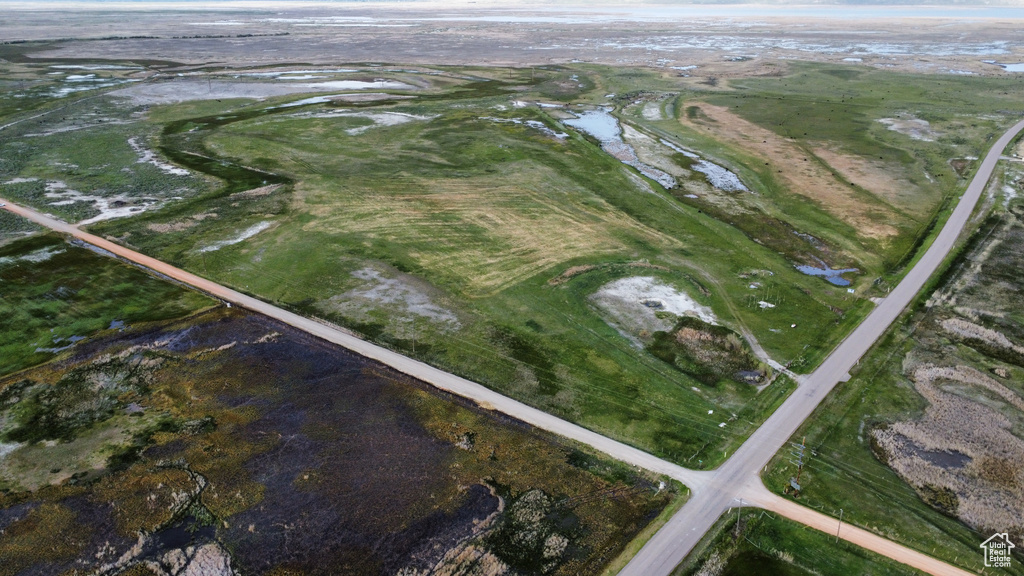 Aerial overview of property's location with a nearby body of water