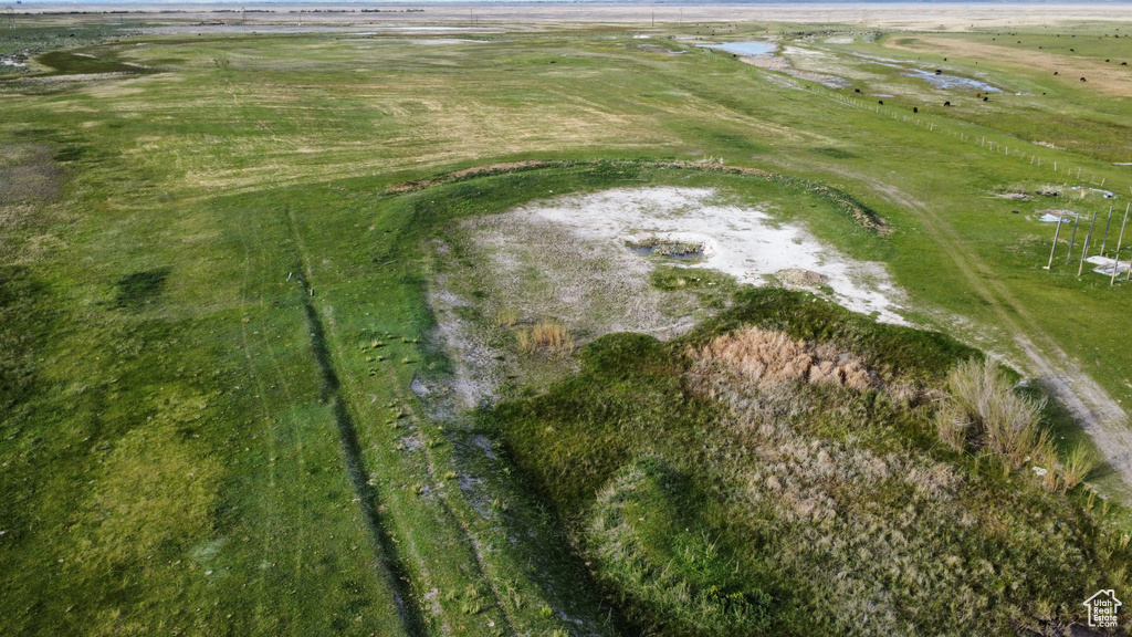 Aerial view of property and surrounding area featuring rural landscape