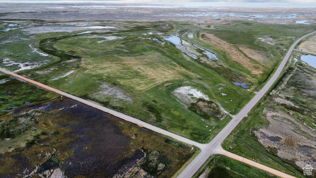Aerial view of property's location featuring a nearby body of water