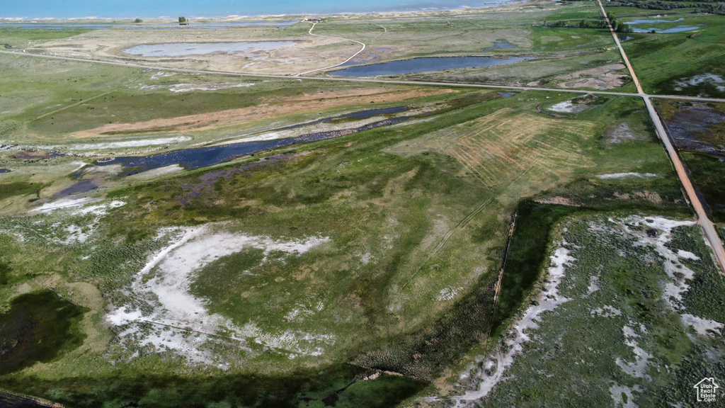Aerial overview of property's location featuring a large body of water