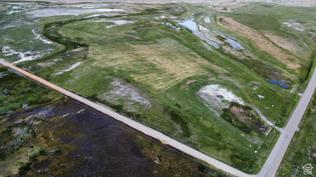Aerial view of property's location with a large body of water