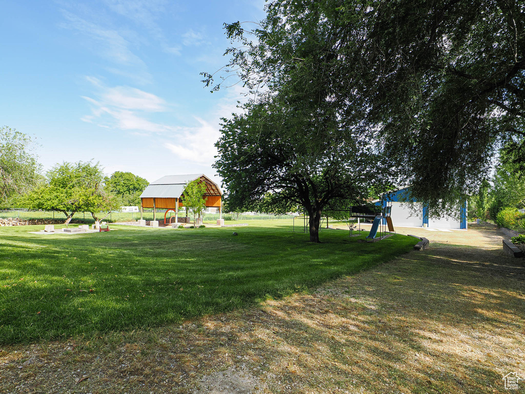 View of grassy yard with an outdoor structure
