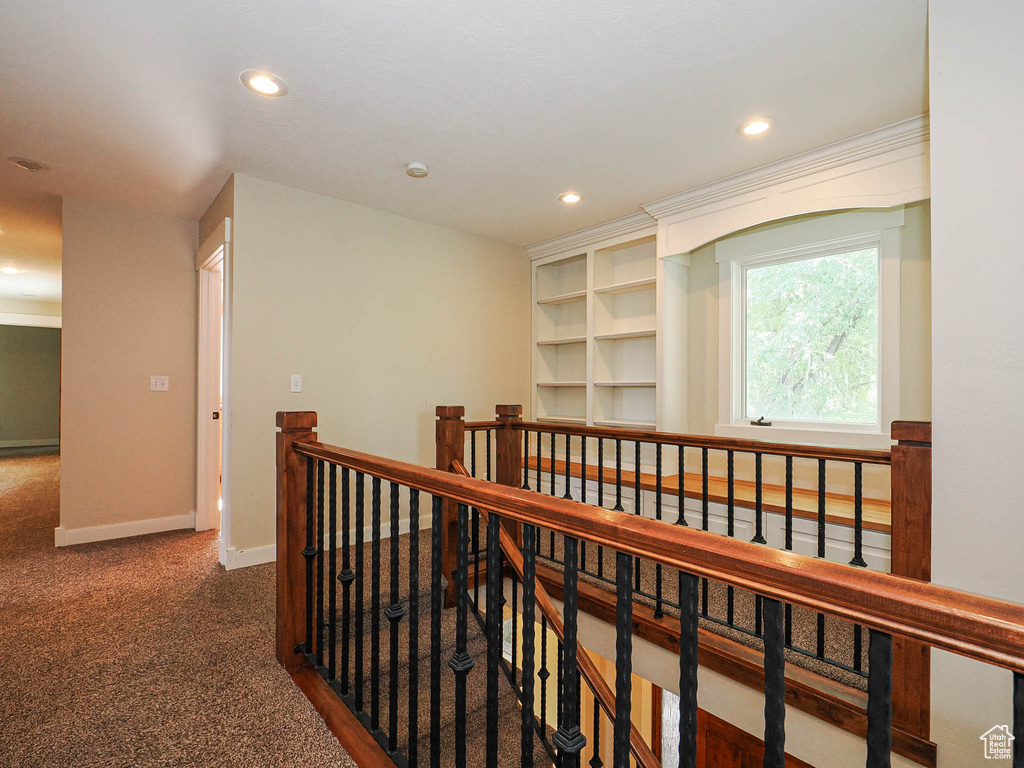 Corridor featuring an upstairs landing, recessed lighting, carpet floors, and baseboards