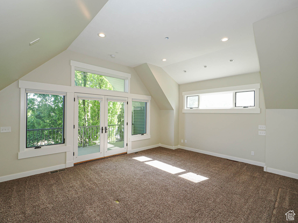 Additional living space with carpet flooring, lofted ceiling, baseboards, and recessed lighting