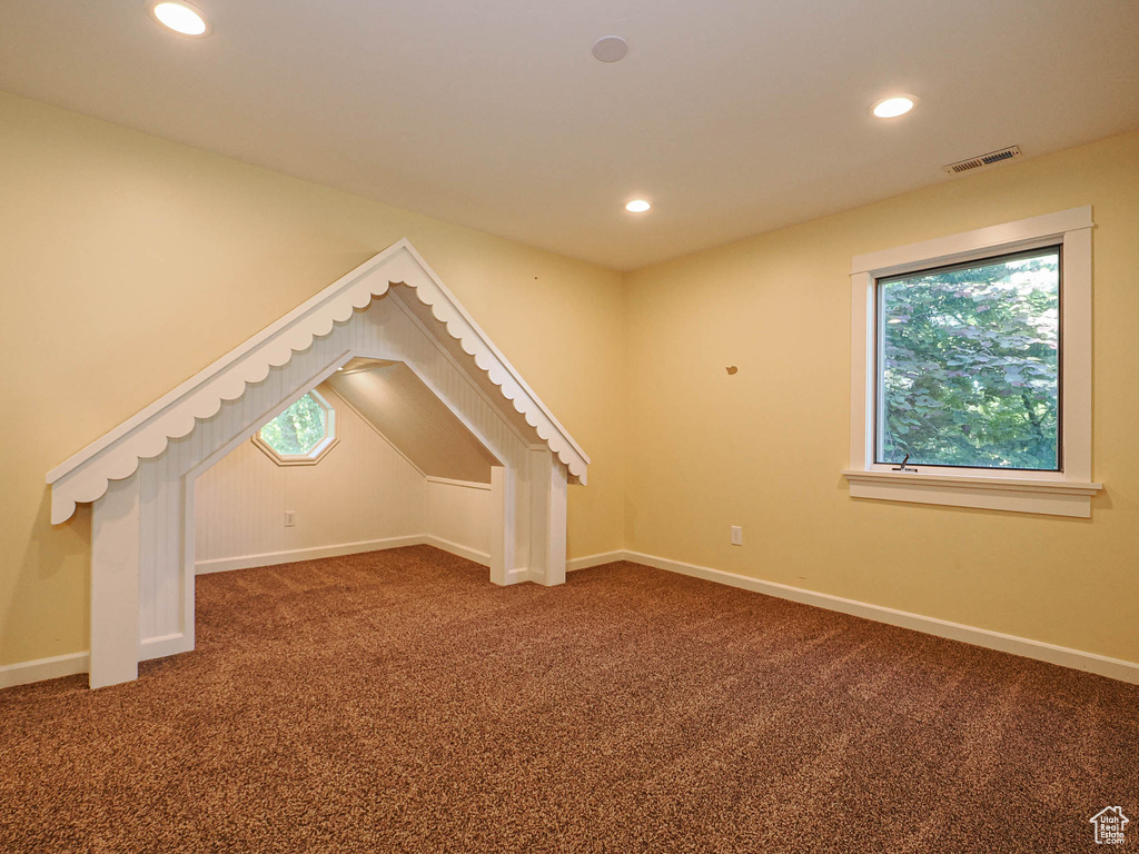 Bonus room featuring carpet flooring, recessed lighting, and baseboards
