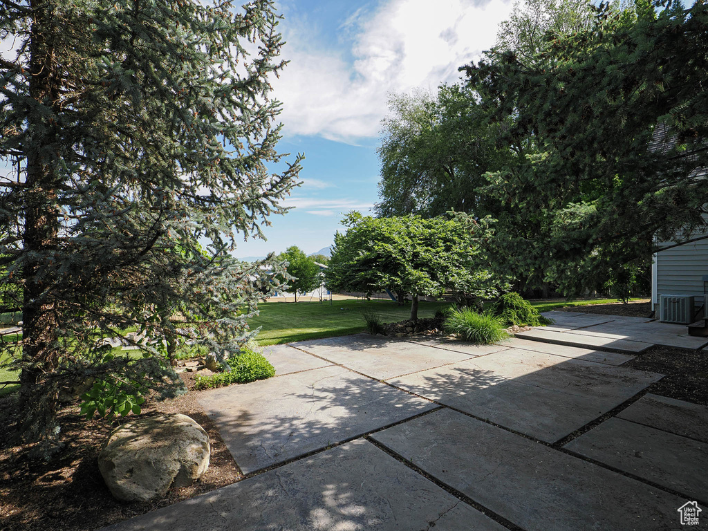 View of patio featuring central air condition unit