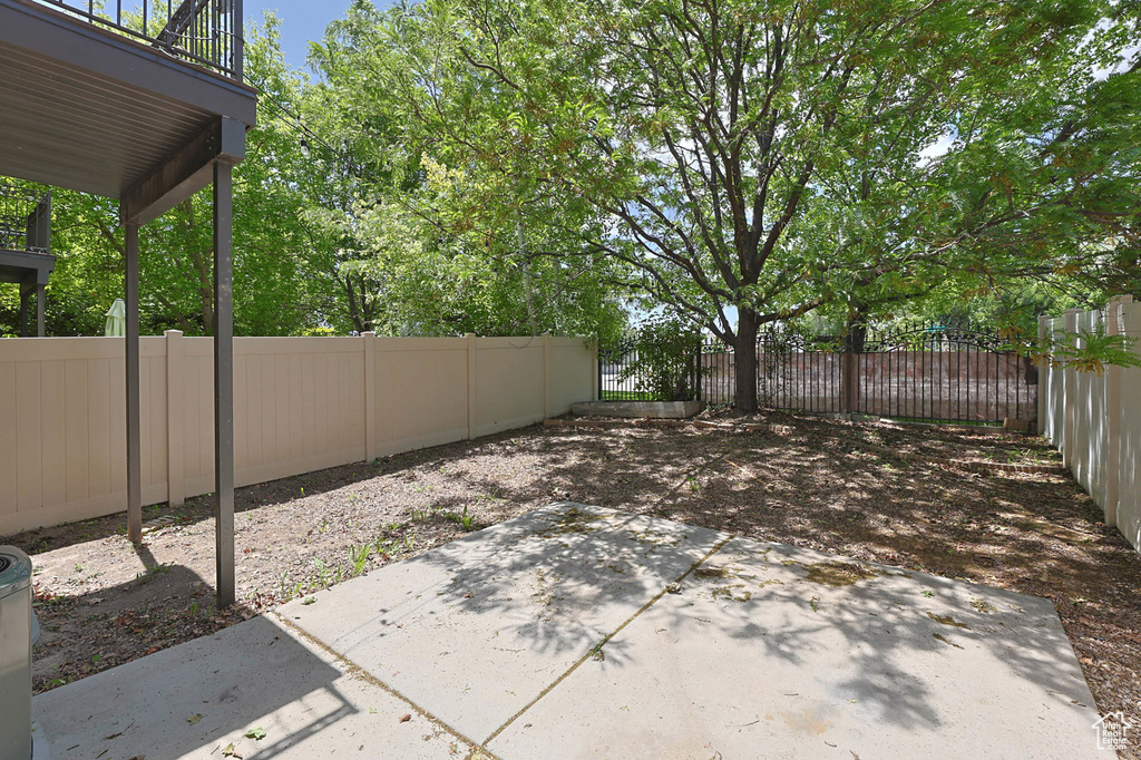 Fenced backyard with a patio
