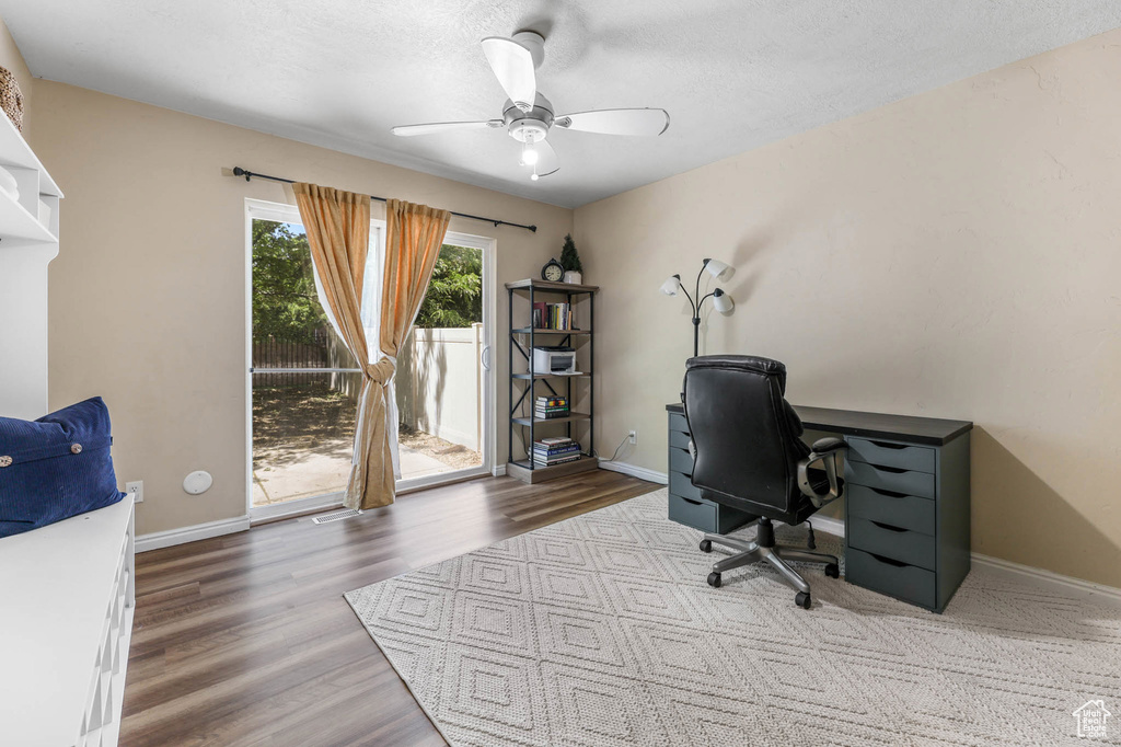 Office featuring ceiling fan, wood finished floors, and baseboards