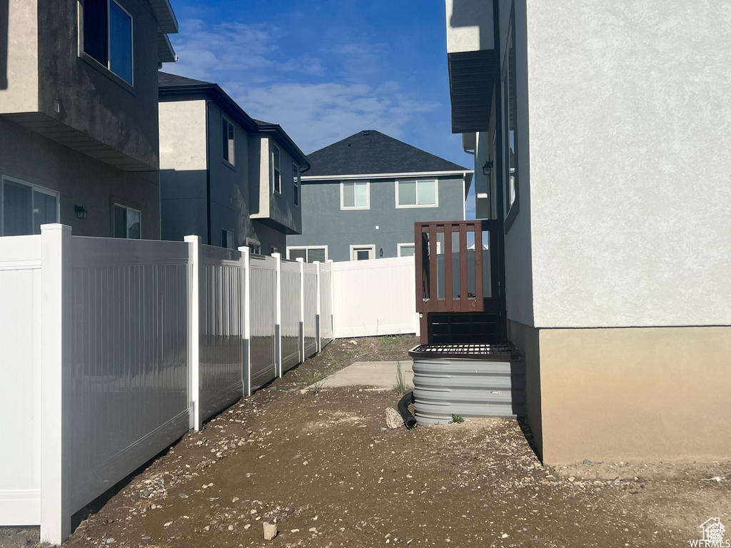 View of side of property featuring stucco siding
