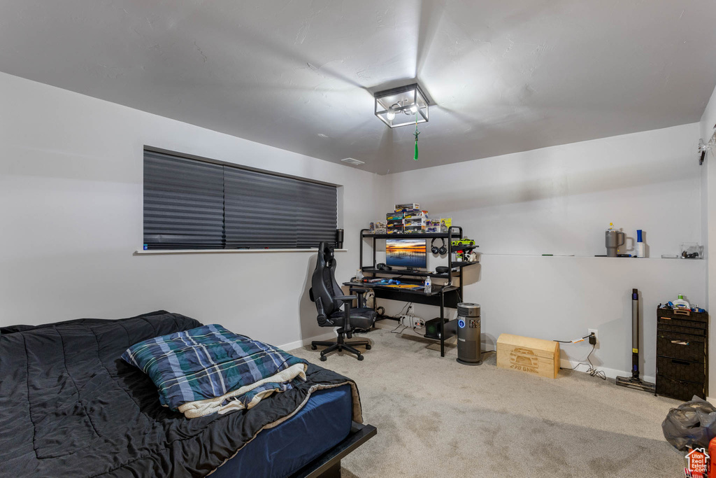 Carpeted bedroom with baseboards