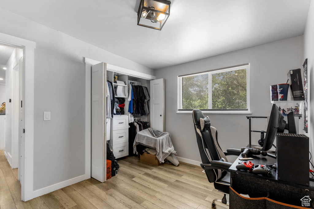 Office featuring light wood-type flooring and baseboards