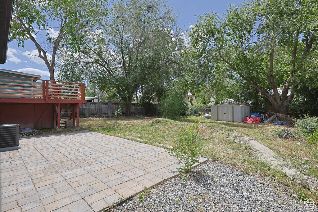 View of yard with a patio area and a deck