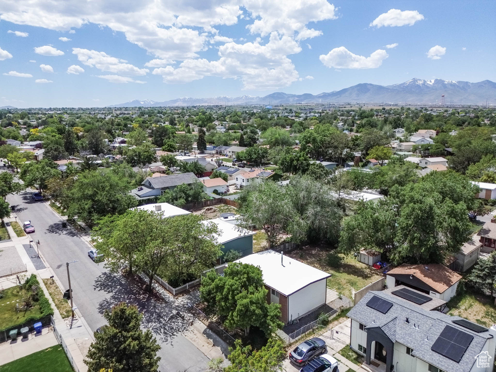 Aerial perspective of suburban area with a mountain backdrop