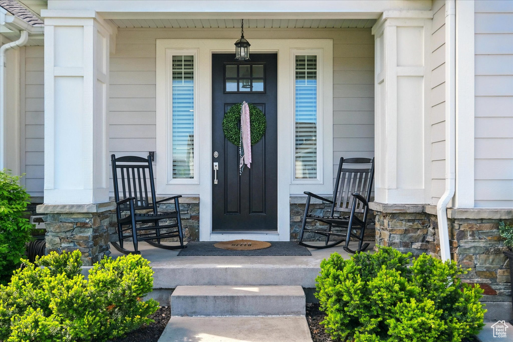 Property entrance with covered porch