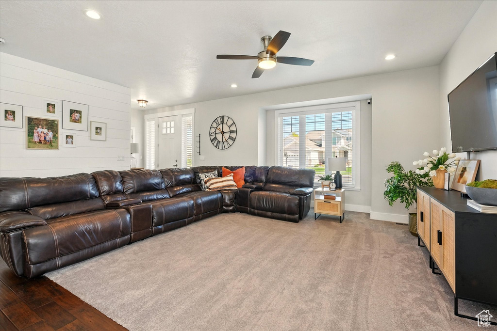 Living area featuring ceiling fan, recessed lighting, and baseboards