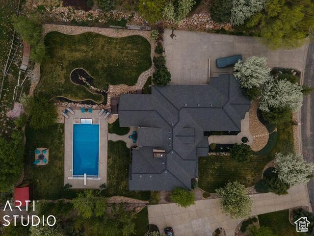 Aerial view of property's location with a pool