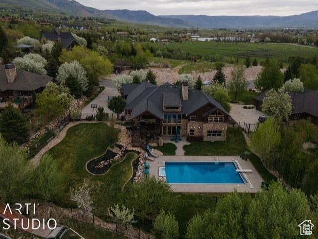 View of property location with a mountainous background and a pool area