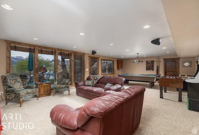 Living room featuring light carpet, recessed lighting, and billiards