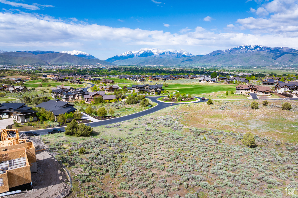 View of mountain backdrop featuring nearby suburban area