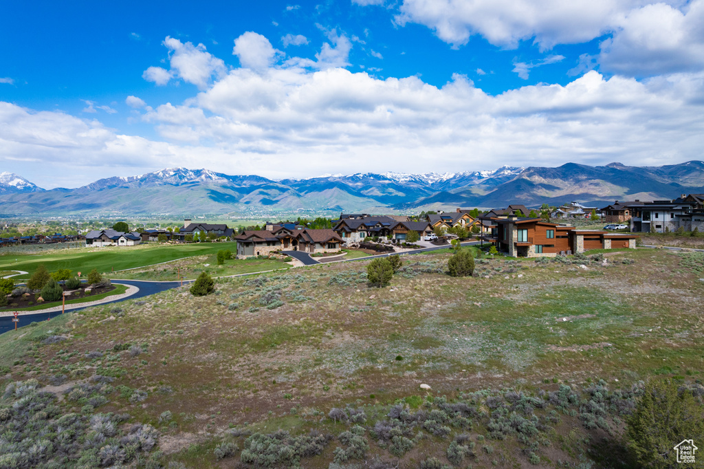 View of mountain background featuring nearby suburban area