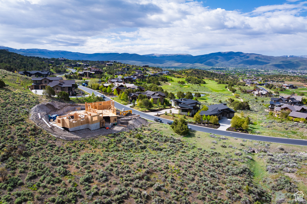 Aerial perspective of suburban area featuring a mountainous background