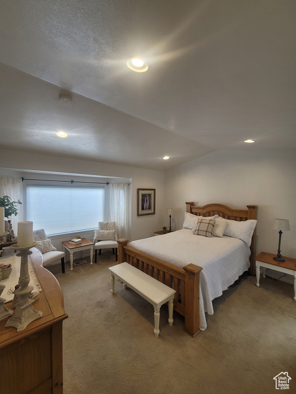 Bedroom featuring light carpet and recessed lighting