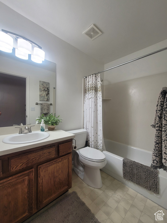 Full bath with vanity, toilet, and shower / bathtub combination with curtain