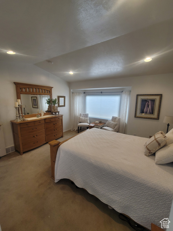 Bedroom with light carpet and recessed lighting