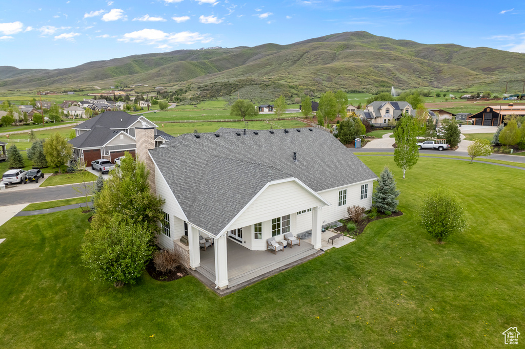 Aerial perspective of suburban area with a mountainous background
