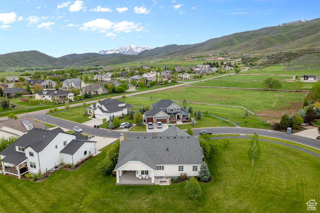 Aerial perspective of suburban area featuring a mountainous background