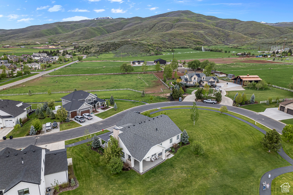 Aerial perspective of suburban area with a mountainous background
