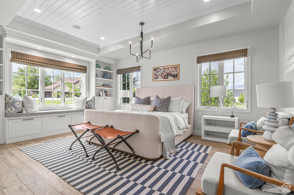 Bedroom featuring light wood-style flooring, multiple windows, a chandelier, wood ceiling, and recessed lighting