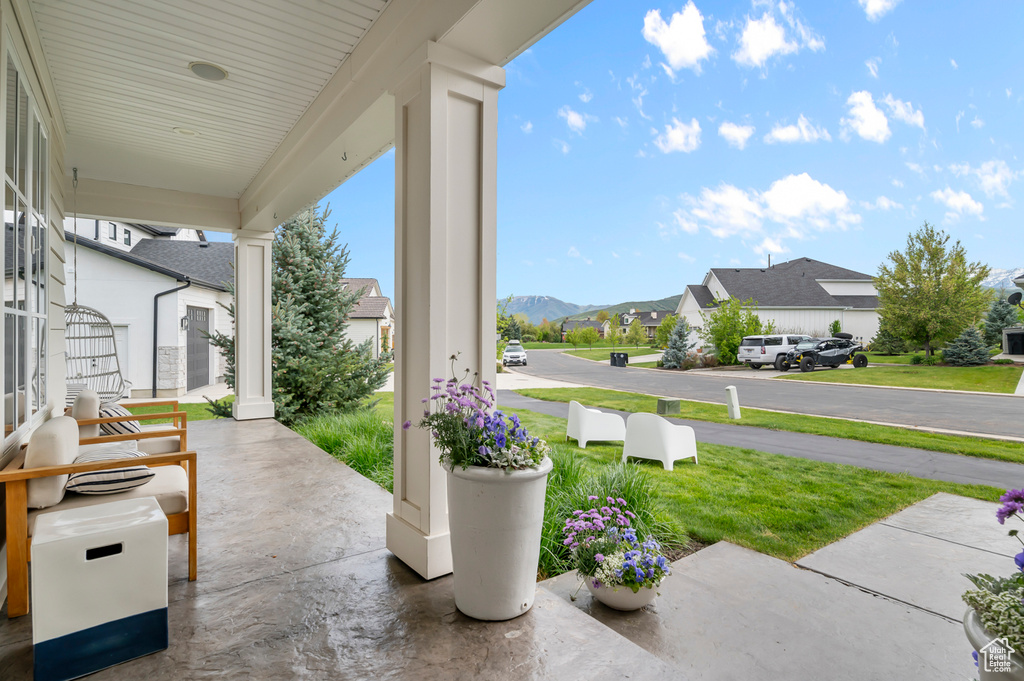 Covered porch with a residential view